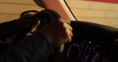 woman driving a car in the night