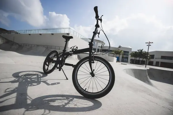 Folding bike in skate park
