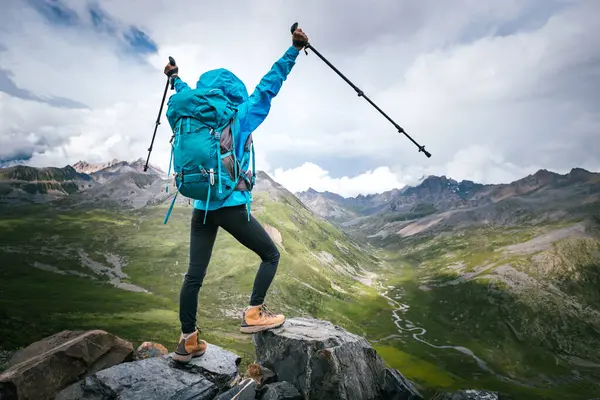 stock image Hiking woman on high altitude mountain top