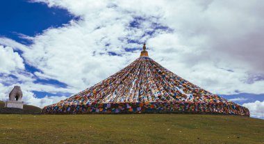 Litang China , 2 September 2024 : Many colorful Tibetan Buddhist prayer flags in Litang China clipart