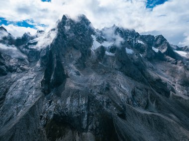 Aerial view of beautiful high altitude snow capped mountain landscape clipart