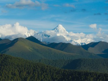 Gonggar Mountain. Beautiful foggy high altitude mountain landscape in China 