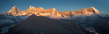 panoramic view over the vast, snow-covered mountains with lakes 