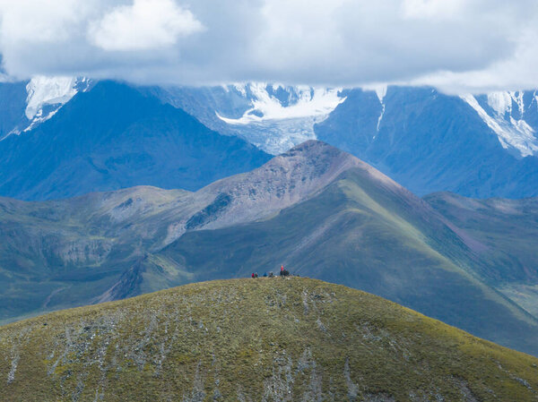 people on the hill. Gonggar Mountain. Beautiful foggy high altitude mountain landscape in China 
