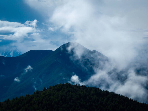 Gonggar Mountain. Beautiful foggy high altitude mountain landscape in China 