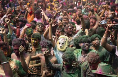 Revellers dancing in the beat of music as they celebrate Holi on a street, the Hindu spring festival of colours on March 25, 2024 in Guwahati, Assam, India. Holi, also known as the Festival of Colors or the Festival of Spring, is one of the most vibr clipart