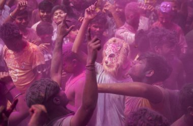 Revellers dancing in the beat of music as they celebrate Holi on a street, the Hindu spring festival of colours on March 25, 2024 in Guwahati, Assam, India. Holi, also known as the Festival of Colors or the Festival of Spring, is one of the most vibr clipart
