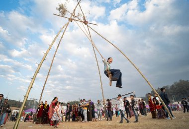 Nepalese people play on a traditional bamboo ping or swing during North East Gurkha festival, on December 27, 2023 in Guwahati, Assam, India. Gorkha Development Council organised the North East Gurkha Festival to showcase the rich heritage of the Gor clipart