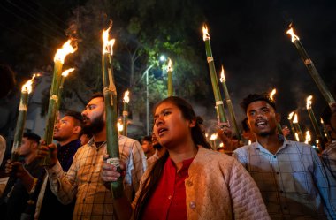 Members of the All Assam Students' Union (AASU) take part in a flaming torch rally and shout slogans to protest against the implementation of the Citizenship Amendment Act (CAA), on March 12, 2024 in Guwahati,  Assam, India. The Citizenship Amendment clipart