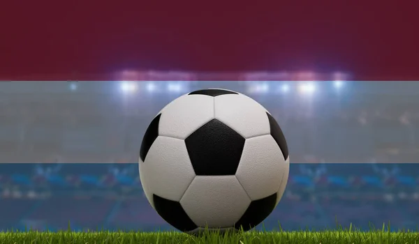 Soccer football ball on a grass pitch in front of stadium lights and luxembourg flag. 3D Rendering.