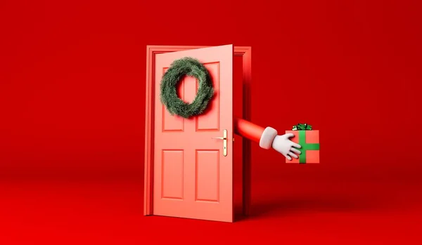 Мультфільм Отець Різдво Рука Доставляє Подарунки Через Червоні Вхідні Двері — стокове фото