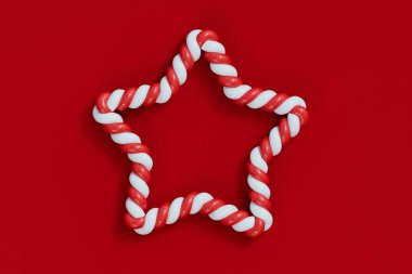 Noel şeker kamışı kırmızı ve beyaz çizgili çerçeve. Şenlikli çizgili şeker. 3B Hazırlama.