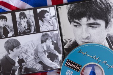 London, UK - August 27 2024: Oasis band cds. Oasis are a popular rock band from the 1990s britpop era. clipart