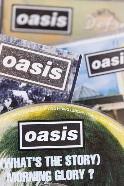 stock image London, UK - August 27 2024: Oasis band cds. Oasis are a popular rock band from the 1990s britpop era.