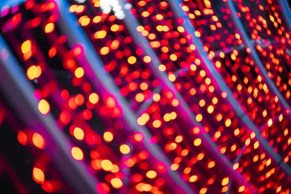 Abstract lights. Christmas street decoration lights, out of focus, red color, with black background. Tenerife, Canary Islands, Spain.