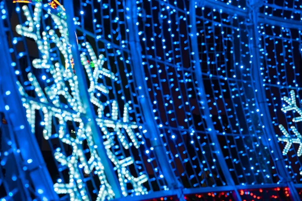 Abstract lights. Christmas street decoration lights, out of focus, blue color, with black background. Tenerife, Canary Islands, Spain.