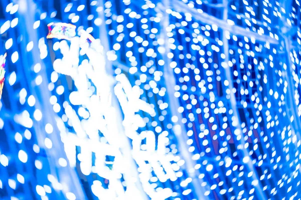 Abstract lights. Christmas street decoration lights, out of focus, blue color, with black background. Tenerife, Canary Islands, Spain.