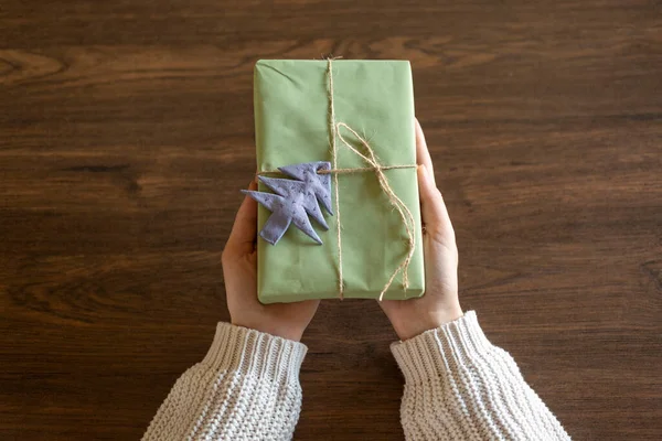 First Person Top View Woman Hands Holding Craft Paper Gift — Stock Photo, Image