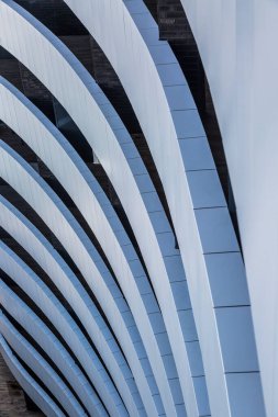Top view of curvilinear balconies. Building exterior of modern architecture.