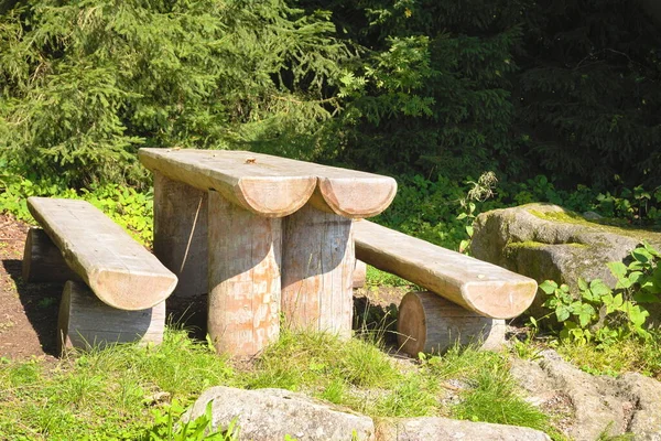 Natural furniture - massive outdoor seating area as a resting place made from sustainable wood