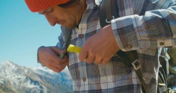Young Traveler Man Putts Tourist Backpack Start Walking Mountain Adventure — Vídeo de stock
