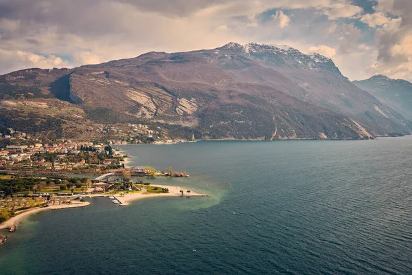 stock image Panorama of Torbole a small town on Lake Garda, Italy. Europa.Beautiful Lake Garda surrounded by mountains  in the spring time seen from Mount Brione