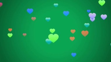 Animasyon yeşil kalp şekli yeşil arkaplanda yüzüyor.