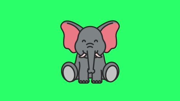 緑の背景に座っている動物の象 — ストック動画