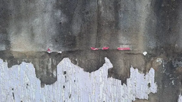 stock image Wall with dark mold/fungus, peeling white paint, and some cracks