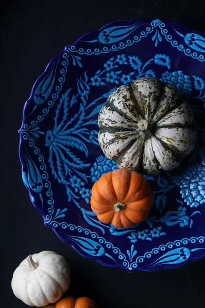 stock image Pumpkins on a blue design plate background, on a Turkish tile design