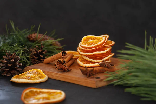 Composition of dry oranges, cinnamon sticks and star anise. Christmas composition.