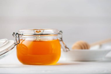 Closeup of fresh fragrant honey in a jar