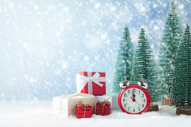 Christmas background. Snowman, watch, present Christmas tree and snow