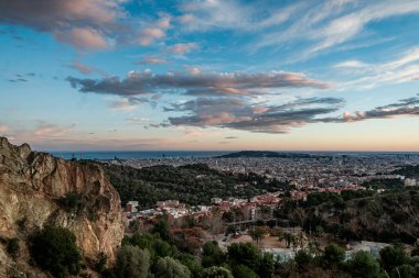 Stunning panoramic view of the city of Barcelona from the Creueta del Coll hill viewpoint. clipart