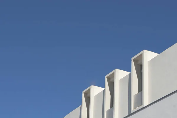 stock image White corner on a modern house against the sky. Vintage pastel colours, minimalist concept. For backdrops and backgrounds.