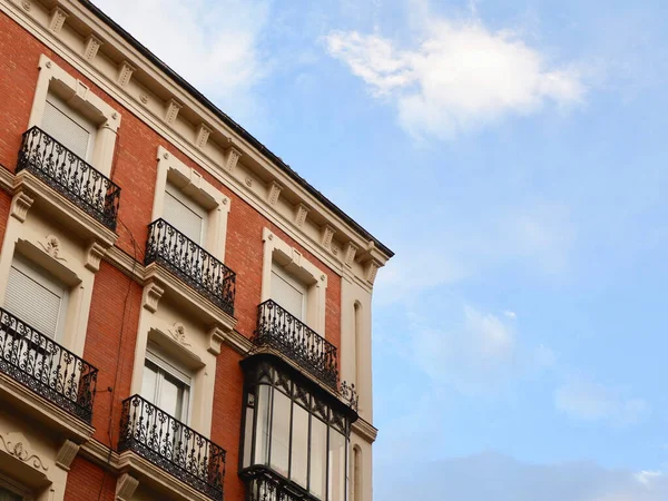 stock image Antique residential building facade in Madrid, Spain. Real estate business, classic architecture style concepts. Vintage architecture. Old fashioned living.