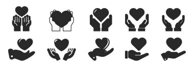 Eller kalp simgesini tutuyor. Sağlık, bağış ve yardım konsepti. Güven sembolü, logo illüstrasyonu. Farklı biçim simgeleri belirlendi