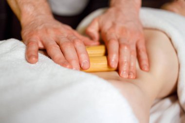 Abdominal massage with bamboo sticks