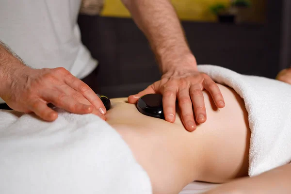 Masseur Massaging Woman Abdomen Lava Stones — Fotografia de Stock