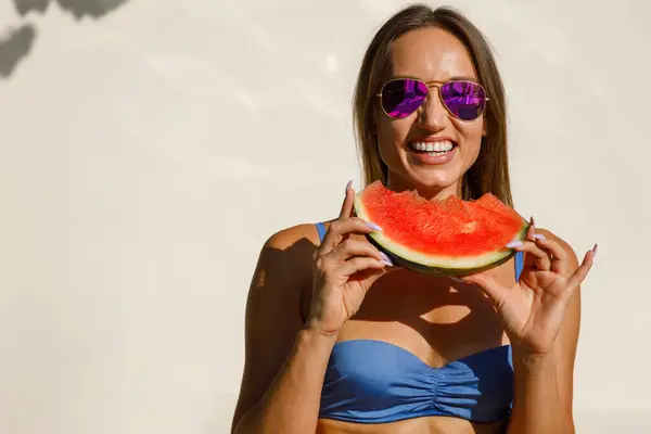 Sun-Kissed Delight: Woman in Sunglasses with Watermelon