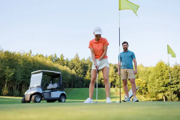 Strategic Hit: Woman\'s Golf Swing on Final Hole