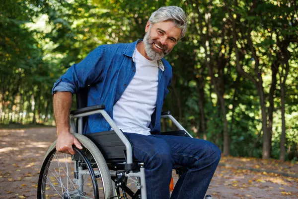 Determination: Wheelchair User Rising in the Park