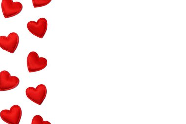 Love concept background with small read hearts isolated on white. Background for a card for Valentines Day. Banner with hearts and copy space.