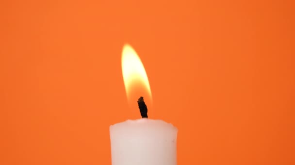 White Candle Orange Background Candle Burning Resolution Video — Stock Video