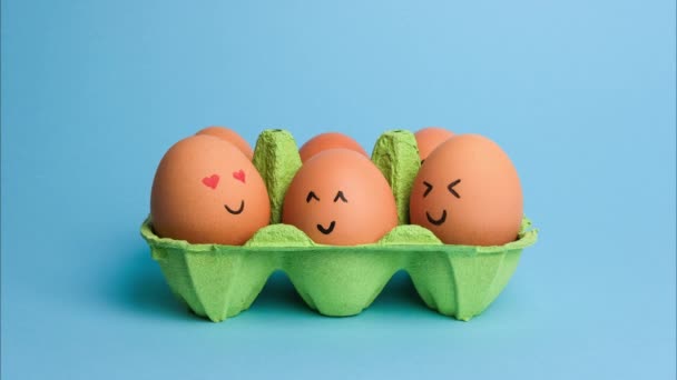Cute Easter Eggs Funny Faces Green Box Isolated Blue Background — Stock Video