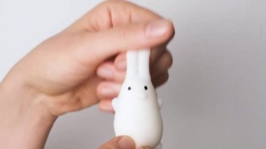 Hands are playing with anti-stress. Close up view on hands play with squash animals. The concept of relieving tension or stress in children and adults. 4K resolution video.