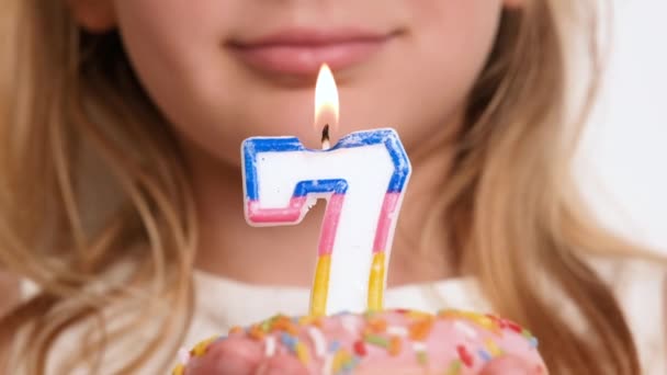 Girl Child Blowing Out Candle Number Seven Pink Donut Happy — Stock Video