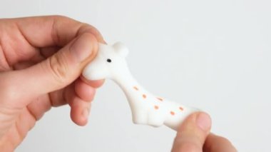 Hands are playing with anti-stress. Close up view on hands play with squash animals. The concept of relieving tension or stress in children and adults. 4K resolution video