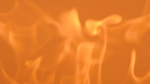 オレンジ色の背景に優しい黄色い炎 炎と炎のスローモーションビデオ 炎と燃える火花のクローズアップ ファイアパターン — ストック動画