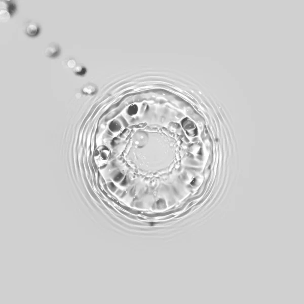 Water texture with circles and drops on the water. Overlay effect for photo or mockup. Organic drop shadow caustic effect with wave refraction of light on a white or gray wall background